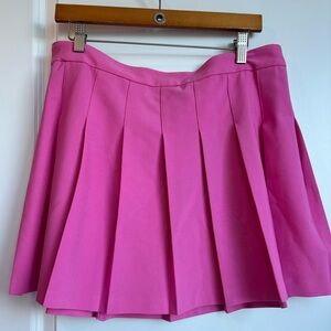 Pink pleated mini skirt